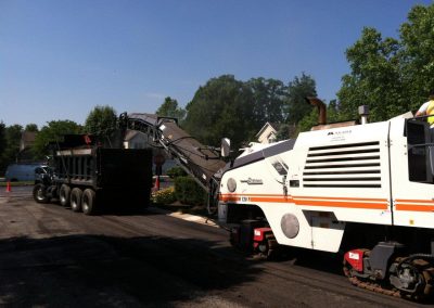Macadam Company asphalt dump truck and scraper